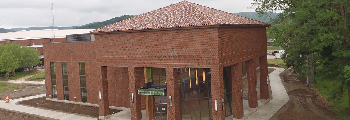 New brick municipal building with a clay-tile hip roof